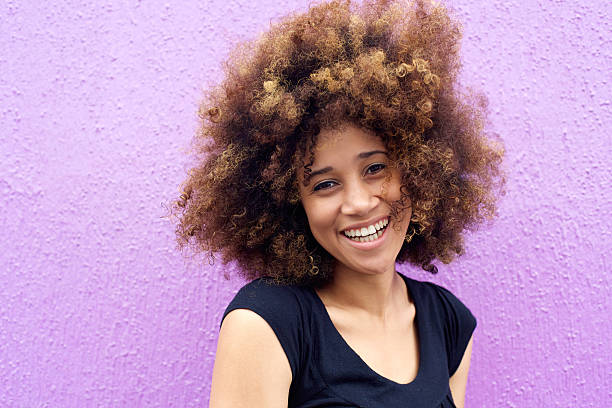 istock Laughing african american woman with afro 506825764