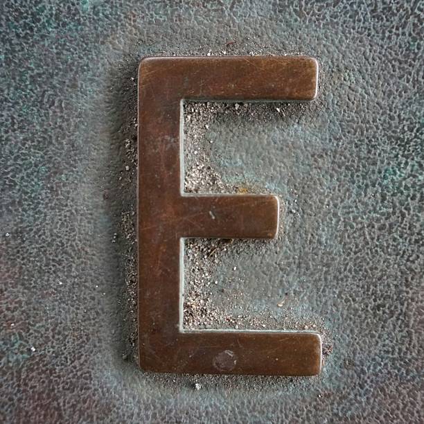 istock Old Aged Copper Patina Text Writing Capital Letter E 506826162