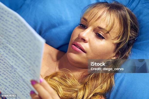 Girl In Bed Crying With Love Letter From Boyfriend Stock Photo - Download Image Now - 20-29 Years, Adult, Bad News