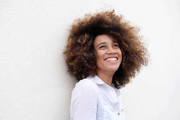 istock Happy young woman laughing ad looking up 506829268