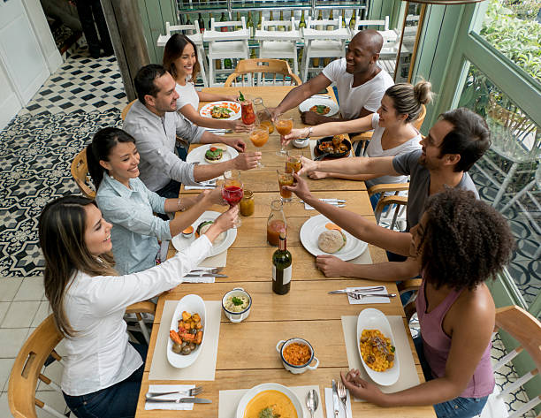 istock Friends at a restaurant making a toast 506829606