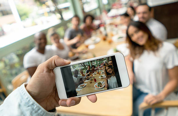 istock Friends eating at a restaurant and taking a picture 506829902