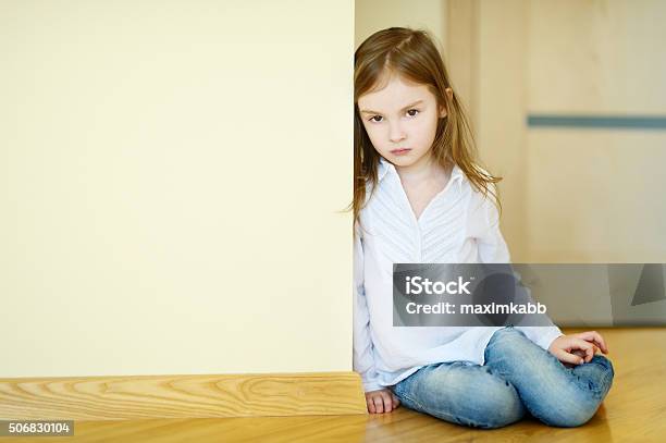 Sad Little Girl Sitting On A Floor Stock Photo - Download Image Now - Anger, Baby - Human Age, Baby Girls