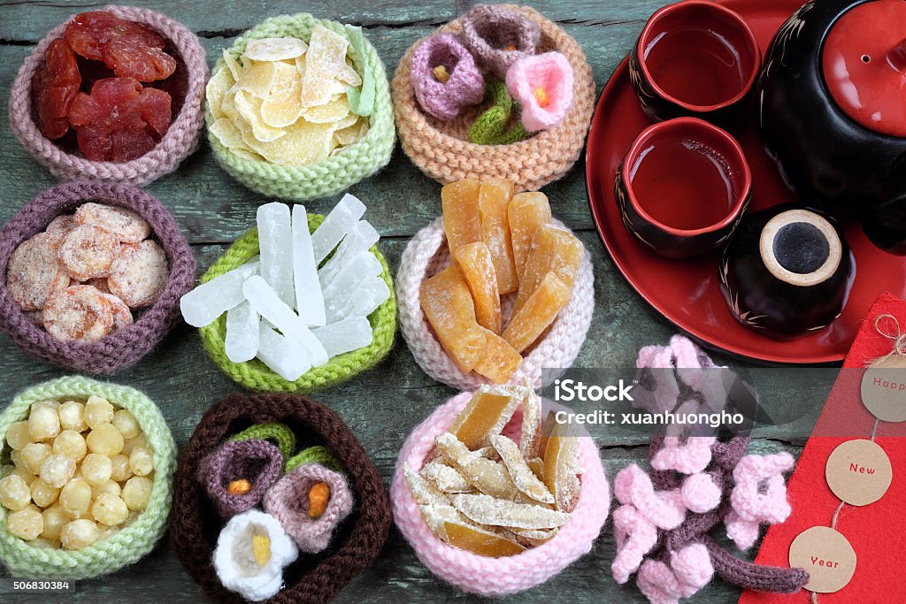 Vietnam culture, Vietnamese food, Tet, lunar new year Amazing of Vietnamese food for Tet holiday in spring, jam is traditional food on lunar new year, make from sweet potato, lotus seed, ginger, mango with sugar, colorful background for Vietnam culture Tet Stock Photo