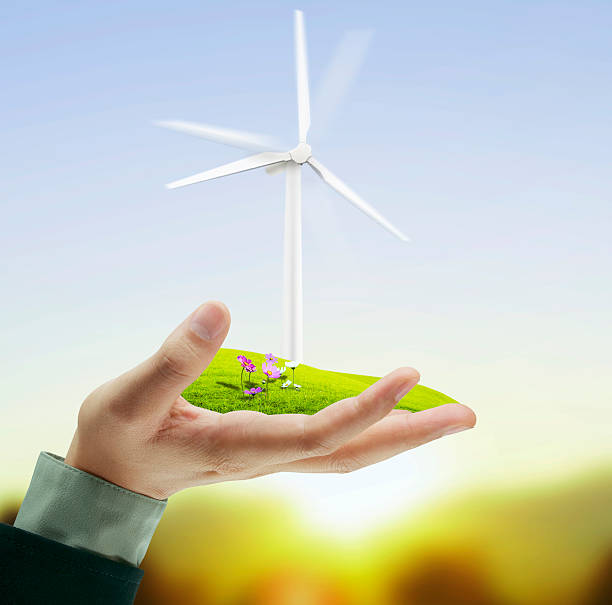 istock Wind turbine in hand 506839711