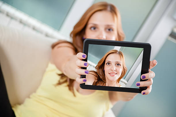 istock Young Female Taking Selfie 506840373