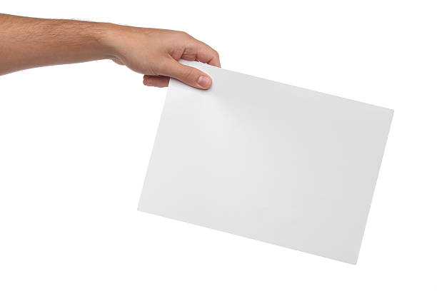 istock Male hands holding blank paper isolated on white background 506840401