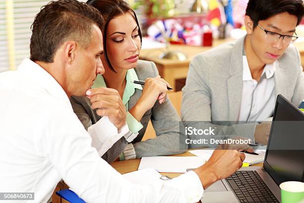 People Working Around Table In Office Stock Photo - Download Image Now - Adult, Adults Only, Business