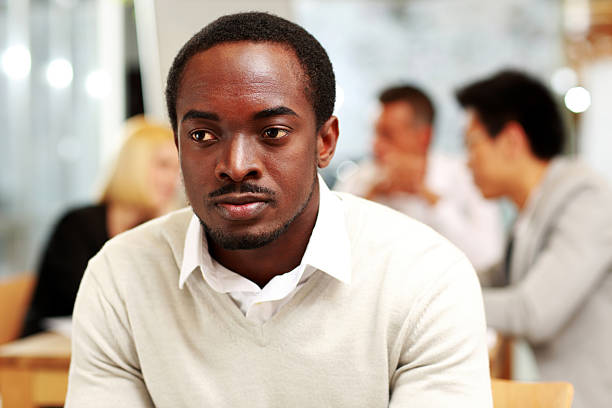 istock businessman sitting in front of colleagues 506840731