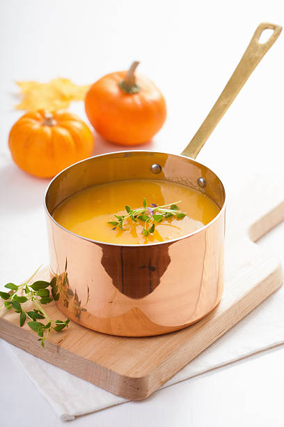 istock pumpkin soup in copper pot 506840981