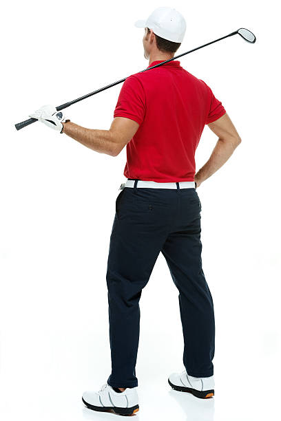 istock Rear view athlete holding golf club & looking away 506841889