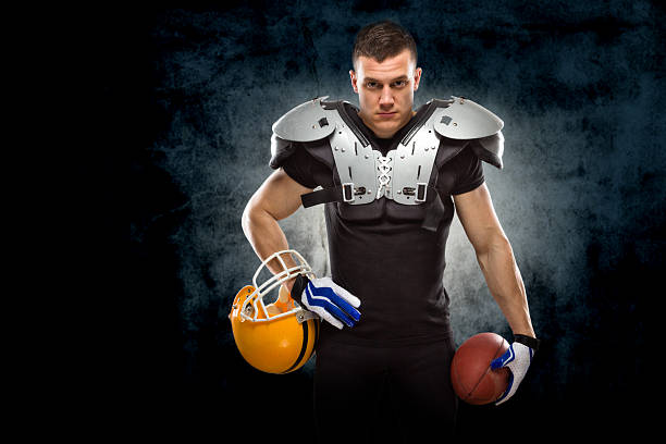 istock American football player posing 506843039