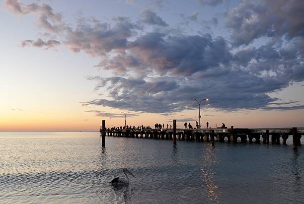 Fishing on the Jetty at Sunset: Silhouettes