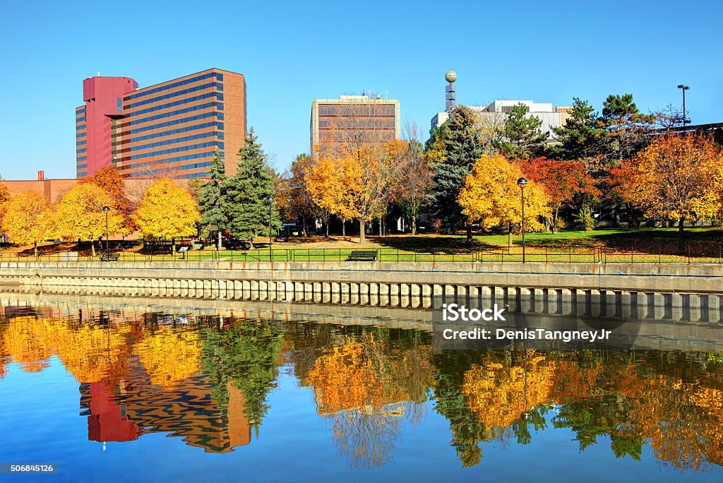 Beautiful Autumn colors in Downtown Flint Michigan Autumn colors along the Flint River in downtown Flint Michigan Flint - Michigan Stock Photo