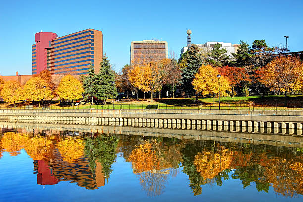 Beautiful Autumn colors in Downtown Flint Michigan Autumn colors along the Flint River in downtown Flint Michigan flint michigan stock pictures, royalty-free photos & images