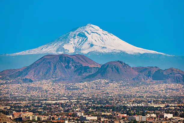 View of the snow covered Popocatepetl Volcano as seen from Mexico City, Mexico.