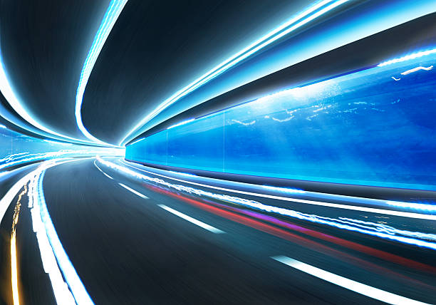 istock Abstract blurred speed motion road in glass tunnel underwater 506845672
