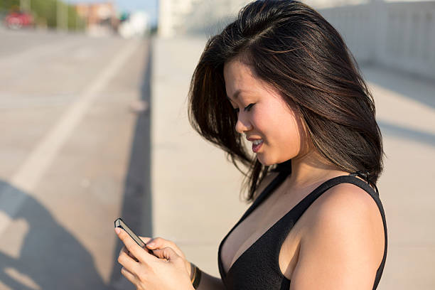istock Young Woman Holding a Cell Phone 506846209