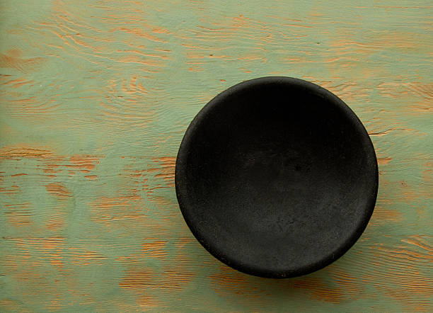 istock Black Bowl, Old Green Wood Table, Copy Space, Full Frame 506846622