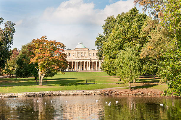 Pittville Park In Cheltenham Pittville Pump Rooms And Park In Cheltenham, United Kingdom gloucestershire stock pictures, royalty-free photos & images