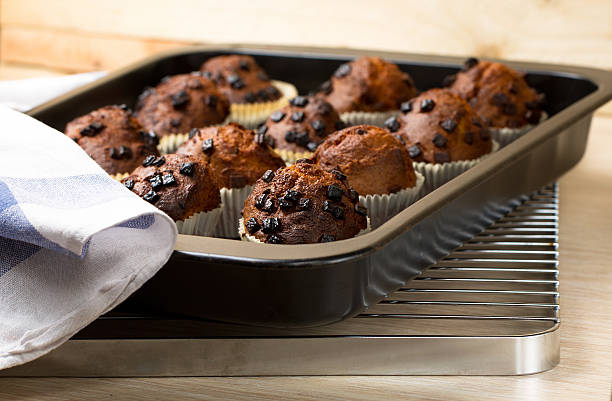 istock Chocolate muffins on a black metal tray 506849566