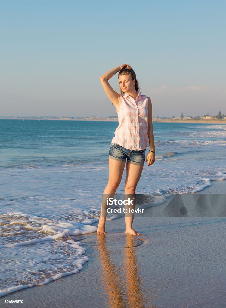 Beautiful girl on the  beach Beautiful girl on the summer beach  in the evening light Adult Stock Photo