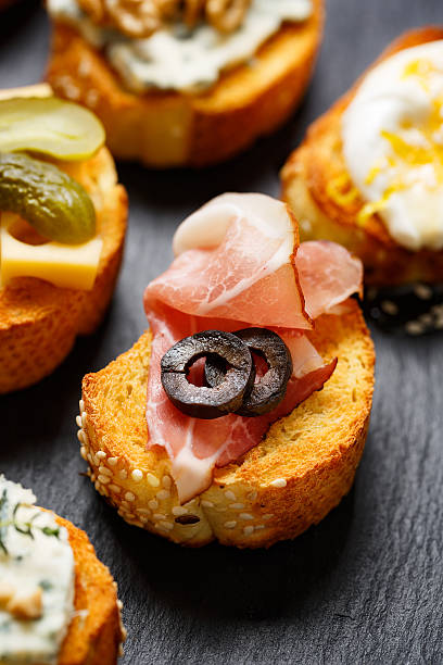 istock Small canape with grilled baguette and ham 506851032