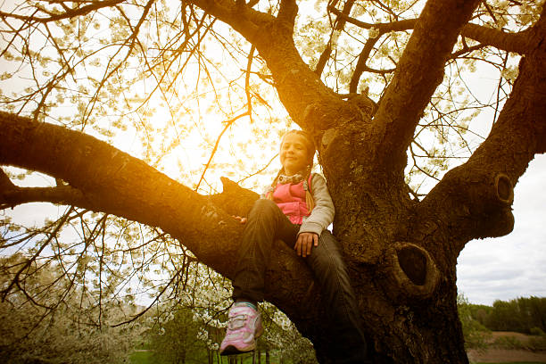 portrait of blonde girl with glasses at playground in the daytime