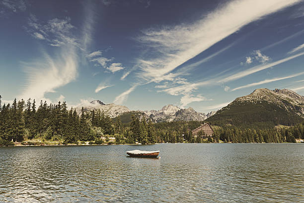 istock Vintage image of alpine mountain lake 506852640