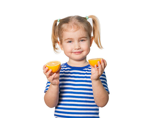 istock Little Funny girl keeps lemons 506853220