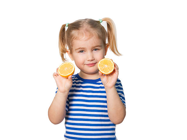 istock Little Funny girl keeps lemons 506853246