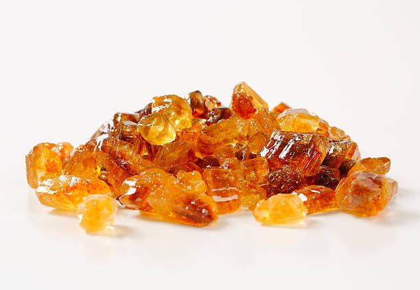 Brown rock sugar Brown rock candy with fine caramel flavor amber stock pictures, royalty-free photos & images