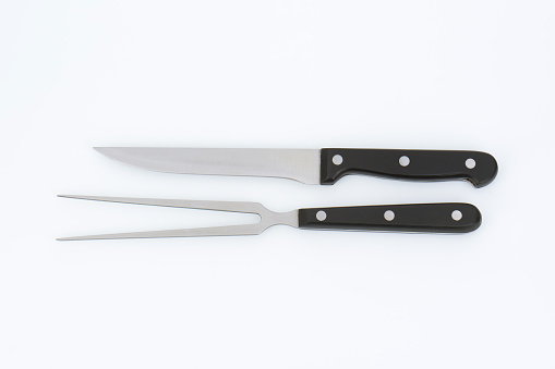 carving knife and fork with black handle