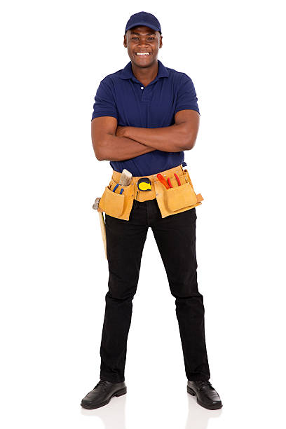 afro amerikanische handwerker mit arme verschränkt - construction worker building contractor craftsperson full length stock-fotos und bilder