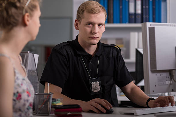 istock Policeman talking with young woman 506858636