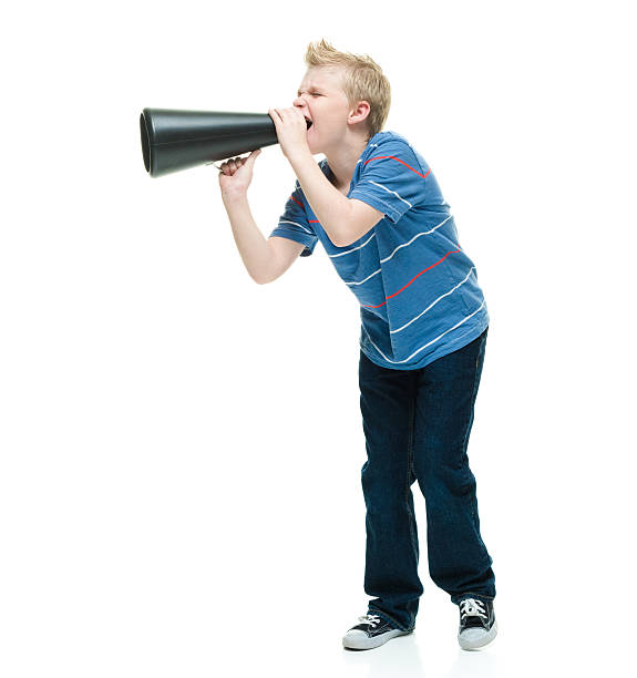 istock Little boy shouting with megaphone 506858860