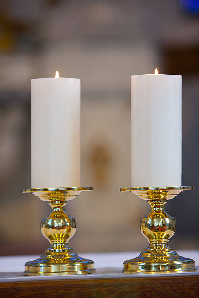 istock Candles in a catholic church 506859544