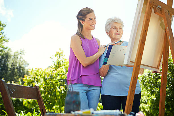 istock She loves watching her mother paint 506860590