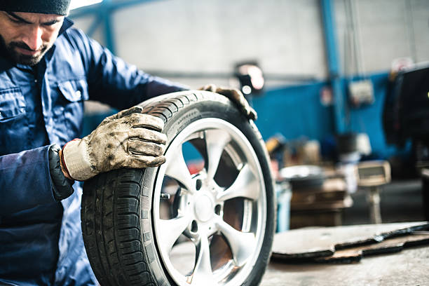 istock tire repairer checking the tire integrity 506860872