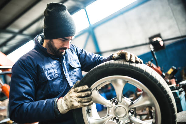 istock tire repairer checking the tire integrity 506861310