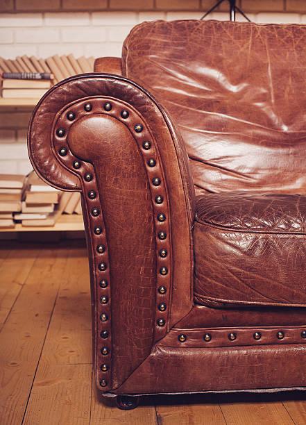 istock Classic Brown leather armchair in  library 506862166