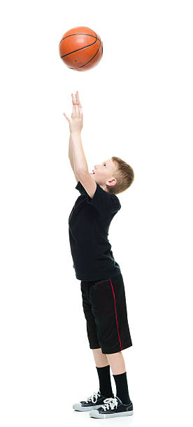 istock Smiling little boy playing with basketball 506868248