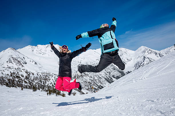 istock Happy couple jumping in mountains 506869626