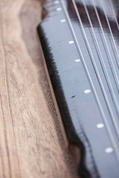 Close-up view of Chinese zither Close-up view of Chinese zither psaltery stock pictures, royalty-free photos & images