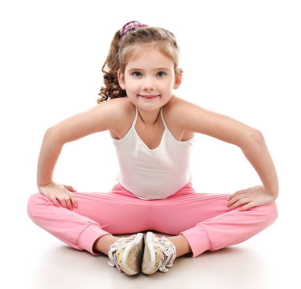 istock Cute little girl doing gymnastic exercise 506871148