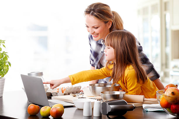 Happy mother and her cute daughter