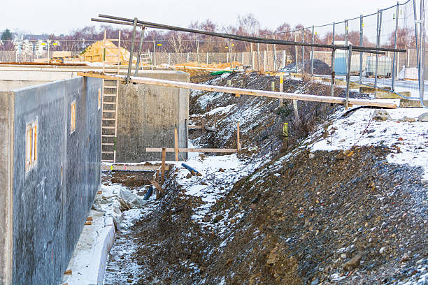 Construction, Structural work and foundations Construction, Structural work and foundations with excavation of a basement floor. basement construction site construction blueprint stock pictures, royalty-free photos & images