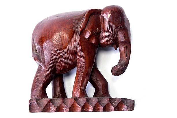 istock wooden carved elephant isolated on white background 506872844