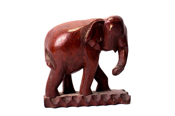 istock wooden carved elephant isolated on white background 506873142