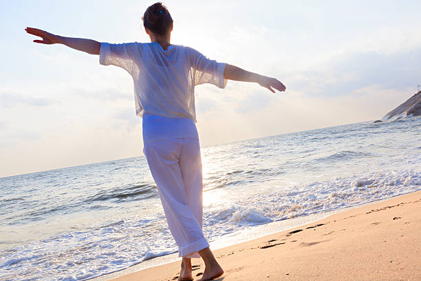 istock Happy woman on beach 506877454